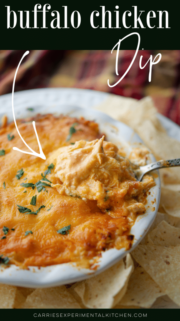 buffalo chicken dip in a dish with some on a spoon