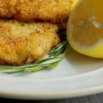 Pork Milanese is a breaded pork made from boneless center cut pork loin and pounded thin and can be served with fresh lemon juice on top of salad.