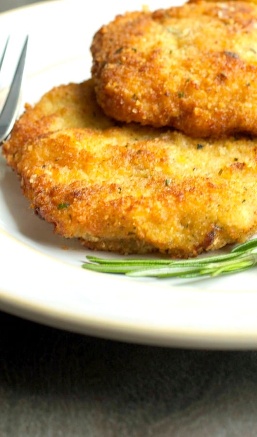 A close up of Italian Style Pork Milanese on a plate. 