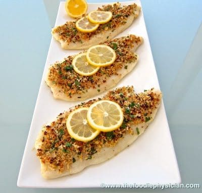 A plate of food on a table, with Flounder and Oreganata