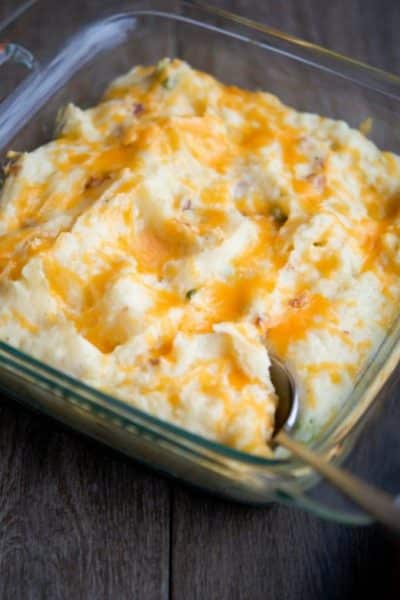 Loaded Mashed Potato Gratin in a glass baking dish.