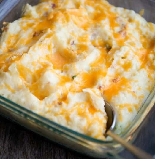 Loaded Mashed Potato Gratin in a glass baking dish.