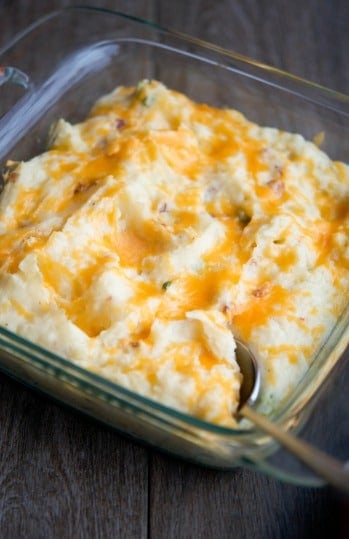 A close up of loaded mashed potato gratin in a dish. 