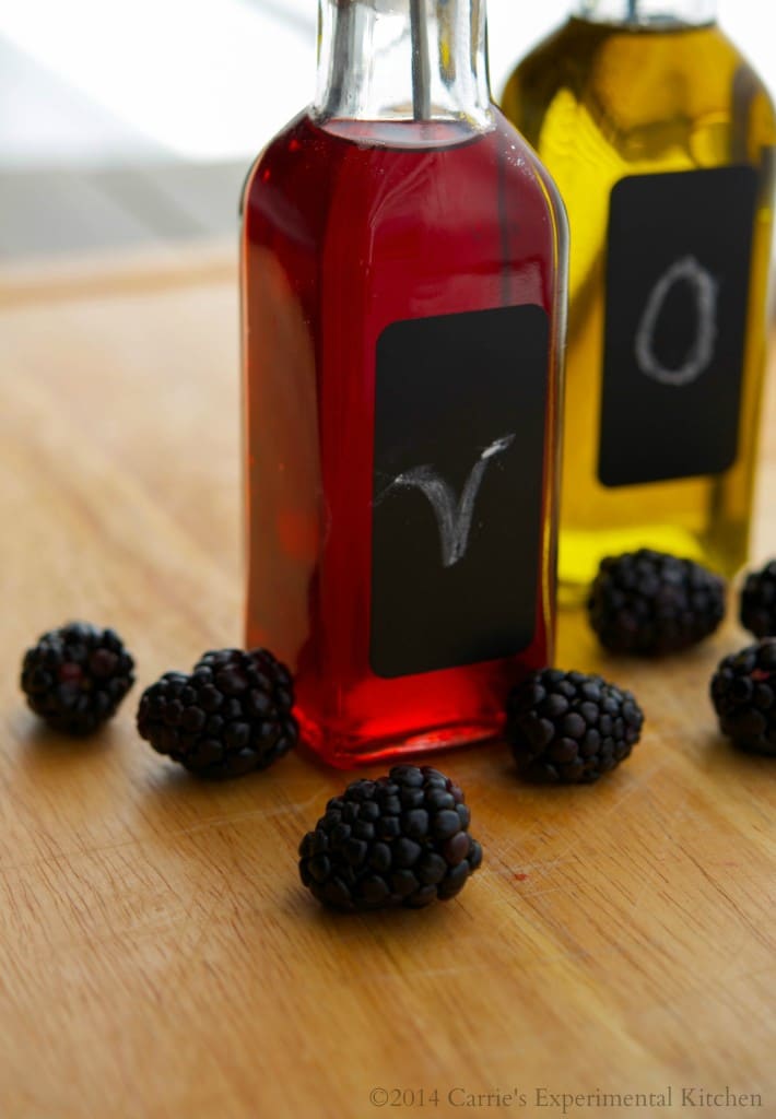 A close up of blackberry vinegar in a jar