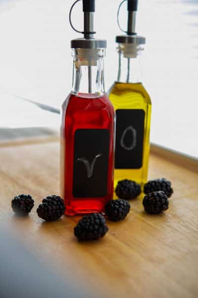 Glass bottles filled with homemade blackberry vinegar