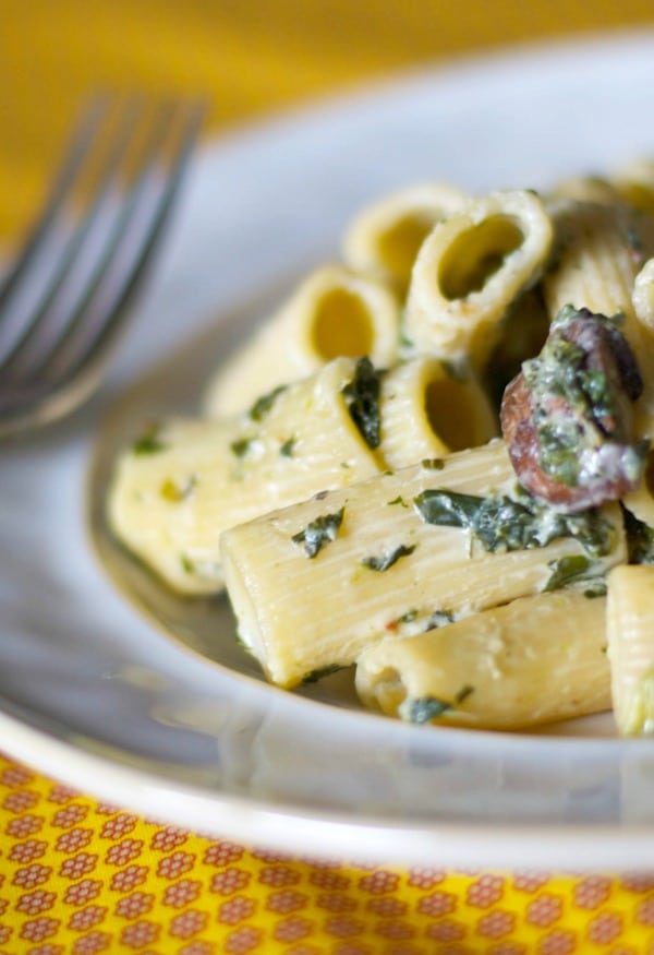 A close up of Rigatoni with Portobello Mushrooms and Spinach.