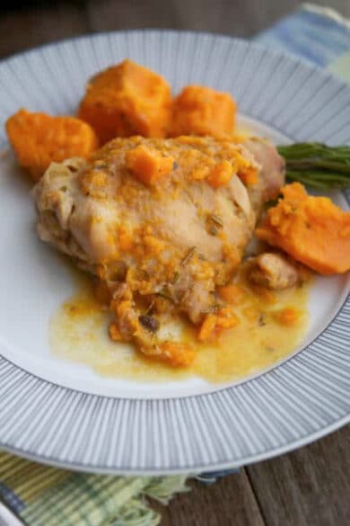 dijon chicken thighs with sweet potatoes on a plate