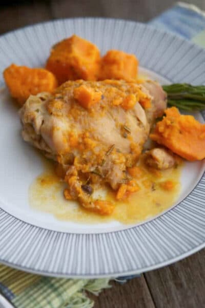 dijon chicken thighs with sweet potatoes on a plate