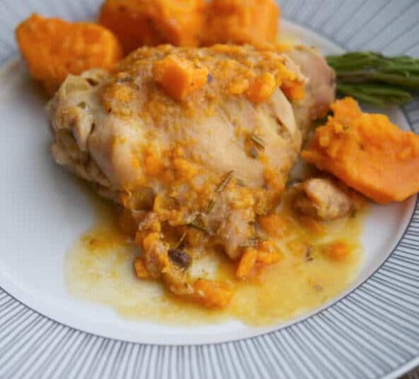 dijon chicken thighs with sweet potatoes on a plate