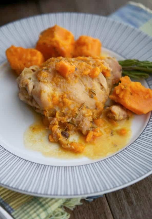 Dijon Braised Chicken Thighs with sweet potatoes on a plate