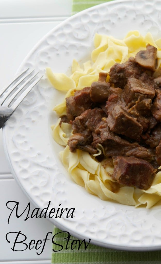 Madeira Beef Stew made with tender cuts of beef, mushrooms, garlic, rosemary and Madeira wine; then slowly simmered in a Dutch oven or crockpot. 