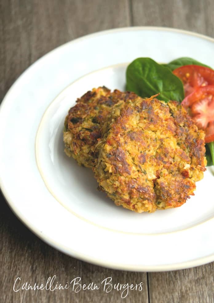  Italian Cannellini Bean Burgers made with oats, spinach, tomatoes, and mushrooms are a deliciously quick and easy weeknight meal.