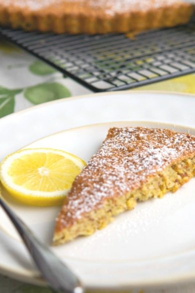 A piece of cake on a plate, with Almond and Torte