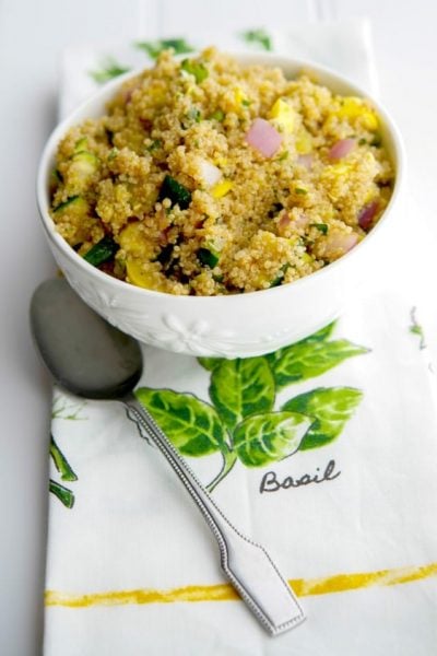 Grilled Squash Quinoa Salad in a white bowl.