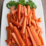 a plate of carrot sticks