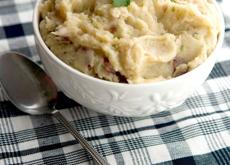 Mashed potatoes made with orange juice and ground cinnamon in a bowl.