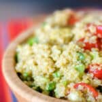 This healthy quinoa salad tossed with fresh avocado, garlic and tomatoes in a lime vinaigrette is light and deliciously filling.