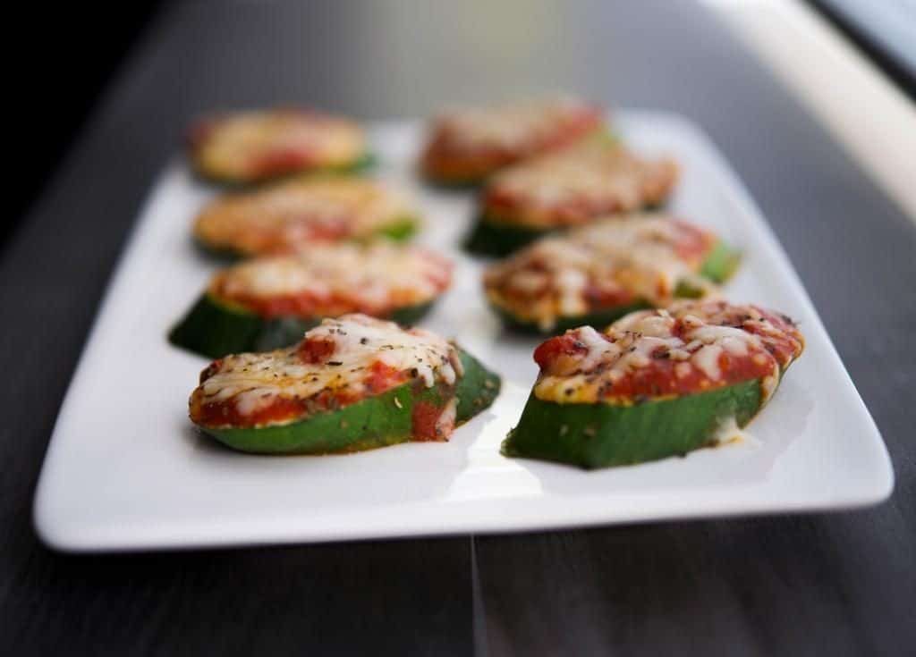 A plate of zucchini pizza close up