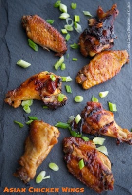 Asian Chicken Wings on a slate board. 