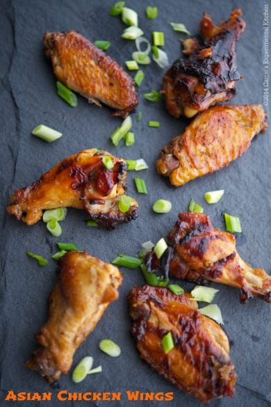 Asian Chicken Wings on a slate board.
