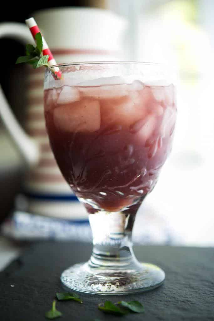 Green tea brewed with fresh blackberries and mint leaves is a flavorful, cool drink you can enjoy all year long.