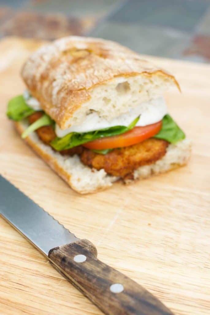 Chicken Cutlet Sandwich with Campari Tomatoes, Buffalo Mozzarella and Basil topped with Aged Balsamic Vinegar.