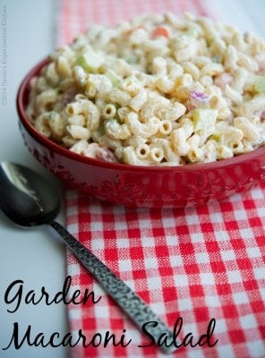 This Garden Macaroni Salad made with fresh tomatoes, cucumbers, celery, carrots and onions is the perfect summer salad. 