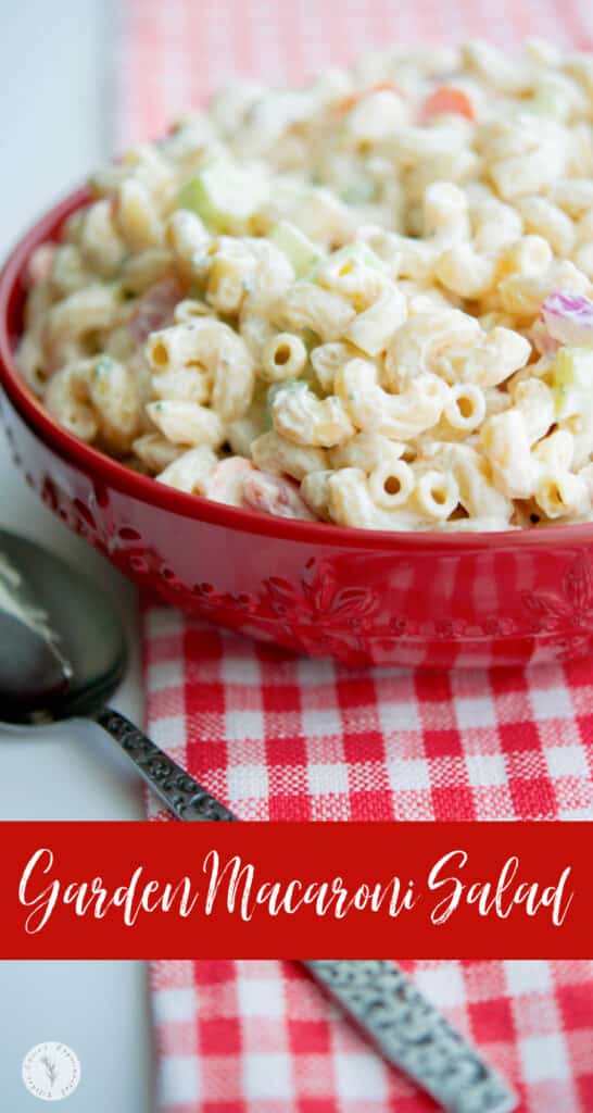 Macaroni salad in a red bowl.