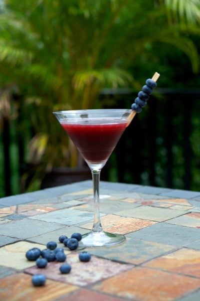 Coconut Berry Martini made with coconut rum, raspberry liquor and Chuck Blueberry cocktail juice.