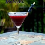 A martini glass with rum, chambord and blueberry juice.