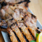 a close up of a lemon basil grilled pork chop