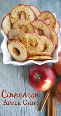 Cinnamon Apple Chips  in a bowl on a wooden table.