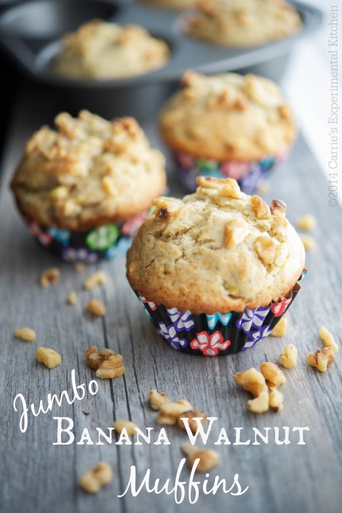 Jumbo Banana Walnut Muffins on a wooden table.