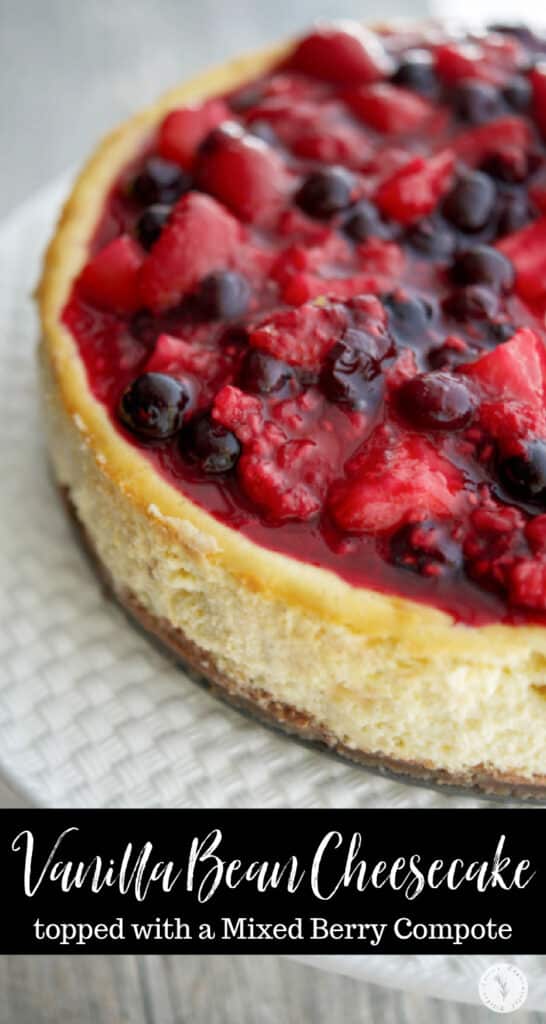 A close up of Vanilla Bean Cheesecake with Mixed Berry Compote.