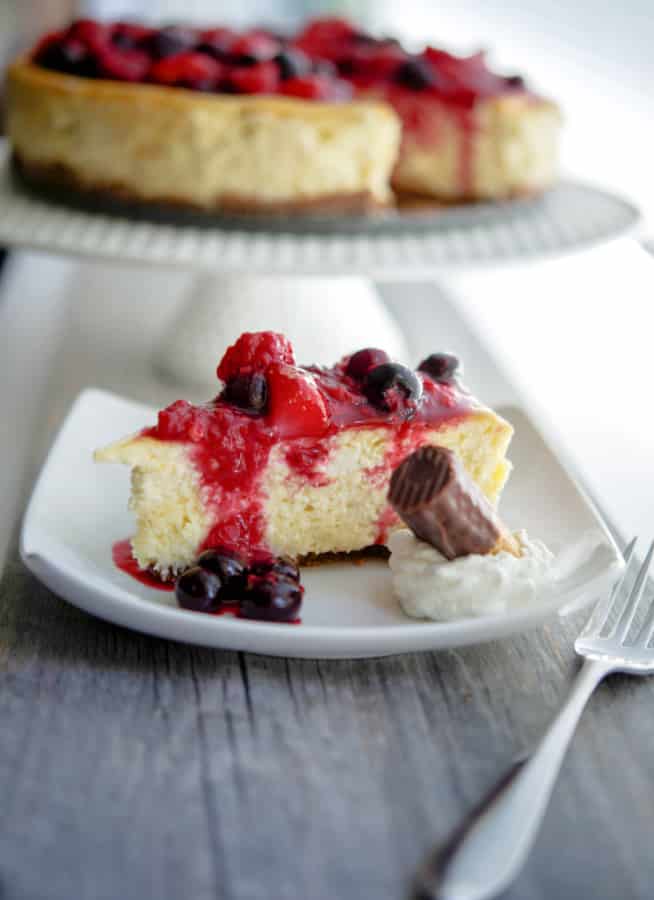 A slice of Vanilla Bean Cheesecake on a plate.