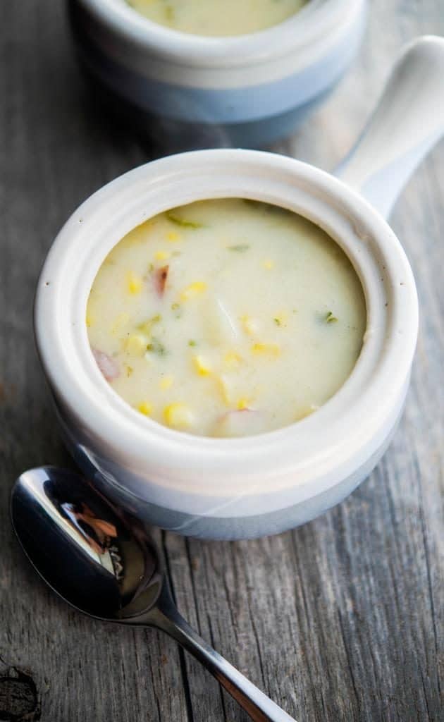 A closeup of a bowl of corn Chowder. 