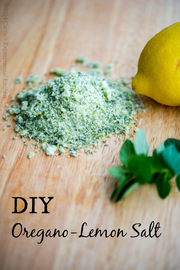 A close up oregano lemon salt on a wooden cutting board. 