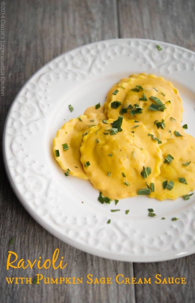 Ravioli topped with pumpkin sage cream sauce on a plate. 