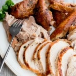 Carved Butter & Herb Roasted Turkey on a platter. 