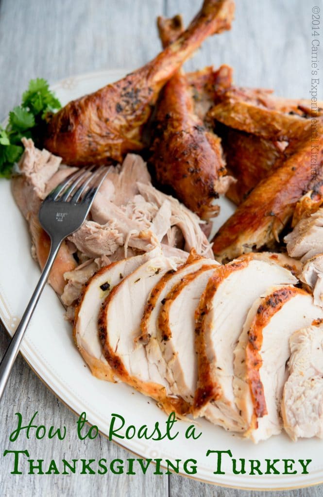 Carved Butter & Herb Roasted Turkey on a platter. 