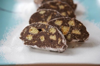 A close up of Chocolate Anisette Salami on a winter plate. 