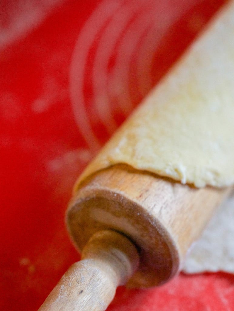 Ravioli dough on a rolling pin. 