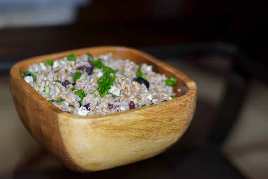 Greek Farro Salad made with farro, Kalamata olives, and Feta Cheese in a light lemony vinaigrette.