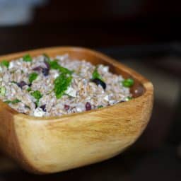Greek Farro Salad made with farro, Kalamata olives, and Feta Cheese in a light lemony vinaigrette.