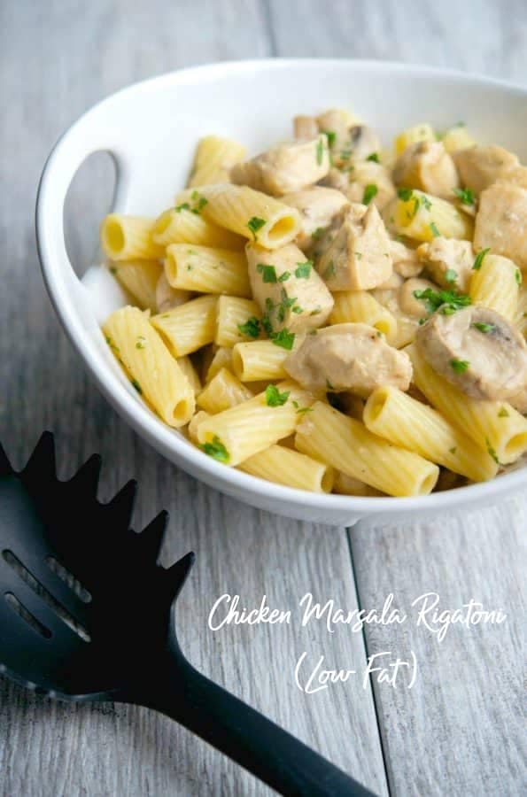 rigatoni pasta in a white bowl with chicken