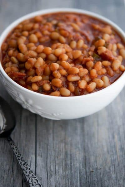 Maple Brown Sugar Baked Beans made with navy beans, maple syrup, brown sugar, peppers and onions are the perfect addition to your Summer BBQ plans.