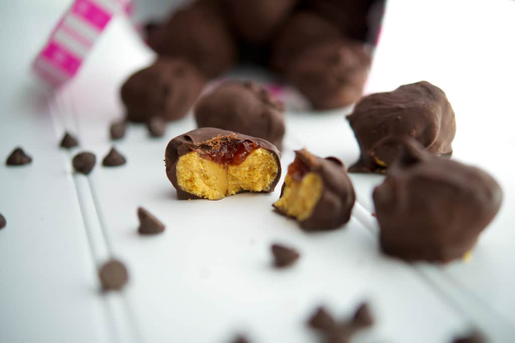 A close up of the inside of peanut butter and jelly truffles. 