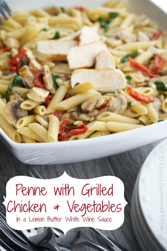 A bowl of penne pasta with chicken and vegetables. 