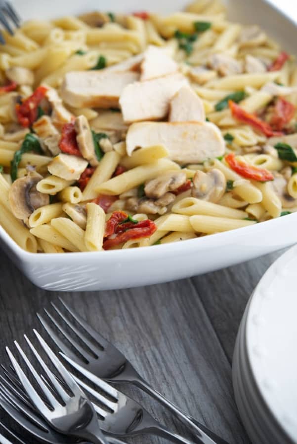 Penne pasta tossed with grilled chicken and seasonal vegetables in a light lemony butter white wine sauce. Makes a tasty quick weeknight meal!