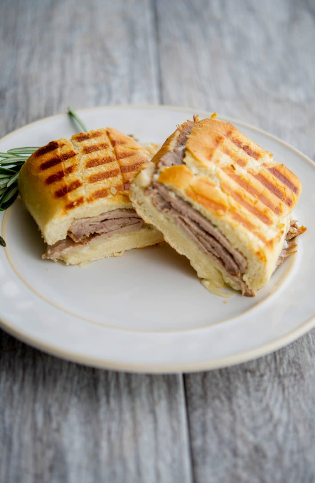 Roast beef, Asiago cheese, and rosemary mayonnaise on grilled Ciabatta bread is a tasty way to utilize leftover roast beef for lunch or dinner. #sandwich #beef #roastbeef #asiagopdo